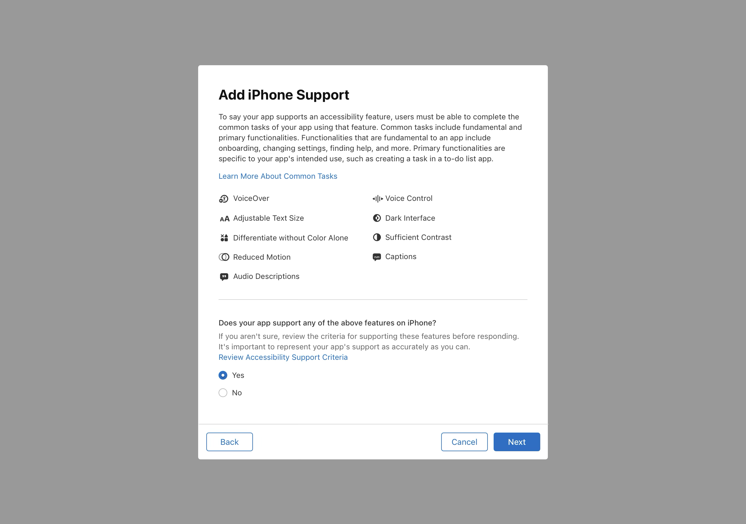 Screenshot of a popup window titled "Add iPhone Support" describes the requirements for supporting an accessibility feature. It lists several accessibility features, including VoiceOver, Voice Control, Adjustable Text Size, Dark Interface, Differentiate without Color Alone, Sufficient Contrast, Reduced Motion, Captions, and Audio Descriptions. It then asks, "Does your app support any of the above features on iPhone?" with "Yes" selected. A link to "Review Accessibility Support Criteria" is presented. There are "Back", "Cancel", and "Next" buttons at the bottom of the window.